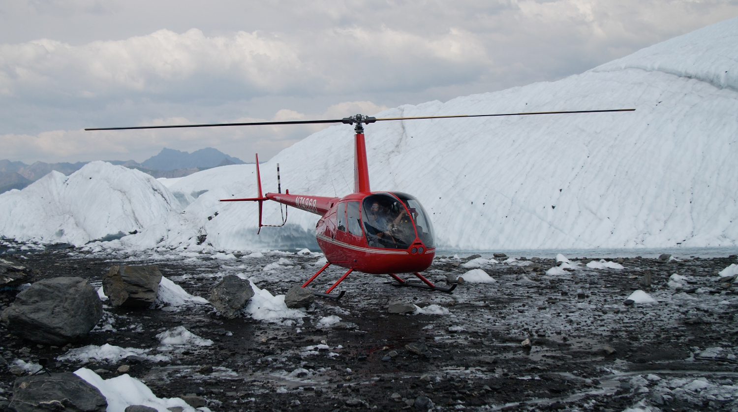 red helicopter glacier landing in Alaska